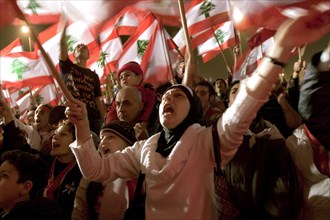 Lebanese protestors celebrate victory at Martyr's Square in Beirut