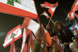 Lebanese protestors celebrate victory at Martyr's Square in Beirut