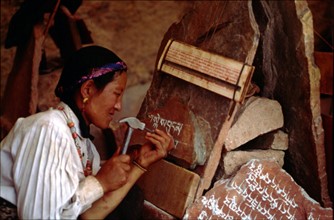 A woman carving scripture on the stone, Lhasa