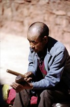 A man playing the folk music instrument