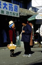 Vieillards chinois en conversation