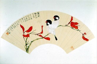 Motifs traditionnels chinois peints sur un éventail