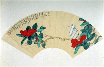 Motifs traditionnels chinois peints sur un éventail