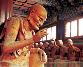Statue de moine bouddhiste priant, Chine