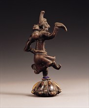 Statuette en cuivre, personnage de style Perse, découvert dans le Gansu
