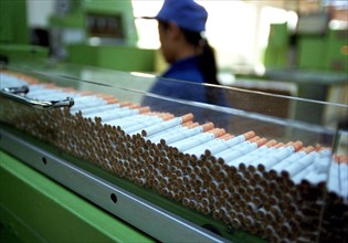 A female worker works on the cigarette assembling line of a tobacco factory of Wuhan, China