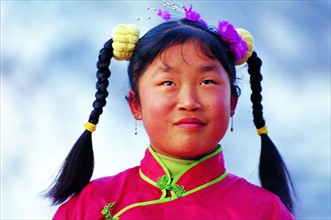 A portrait of a pigtailed girl from Yangjiagou,Mizhi,Shaanxi Province,China