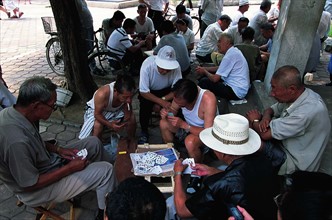 Old men is playing card by the street,Shenyang,Liaoning Province,China