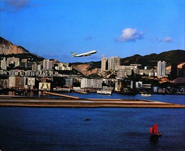 A plane takes off from the Kai Tak International Airport,Hong Kong,China