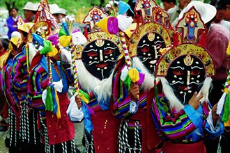 People wear Tibetan masks which are part of Tibetan opera,a show for Shoton Festival,Tibet,China