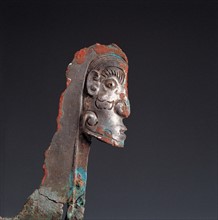 face-shaped ornament from West Zhou Dynasty of ancient Chinaon bronze halberd