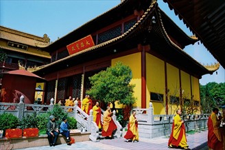 Monks walk in Eryan temple of Shanghai,China