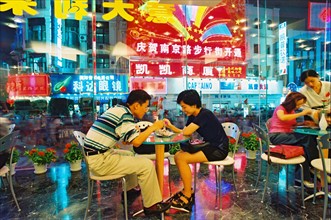 A couple dating in a restaurant on Nanjing road of Shanghai,China