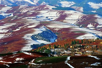 The red soil field covered by snow,Dongchuan,Yunnan Province,China