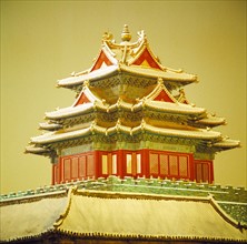 a corner tower of the Forbidden City in snow,Beijing,China