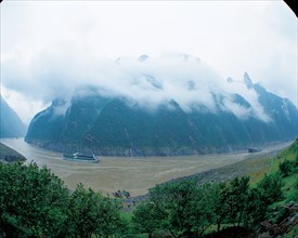 A ship's sailing on the Yangtse River along with foggy mountains,China
