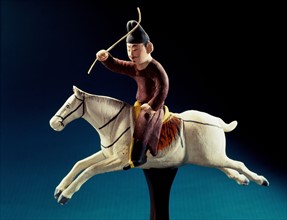 A figurine playing polo from Turpan,Sinkiang,China