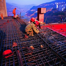 workers are busy with constructing a bridge at Badong County,Hubei,China