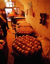 People selling steamed bread at Tianjing Courtyard Cave Dwelling,Shan County,Henan Province,China