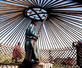 Mongolian people sets up Mongolian tent, Inner Mongolia,China