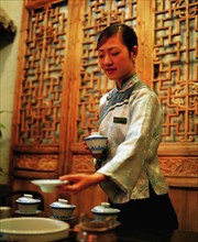 A Chinese woman shows tea art, China