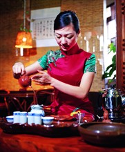 A Chinese woman shows tea art, China