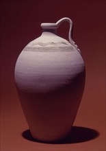 Pitcher in clay with decorations