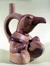 Pot en céramique en forme d'oiseau jouant du tambour