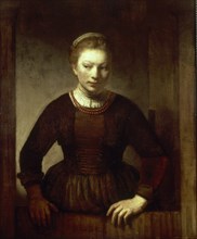 Harmenszoon Van Rijn Rembrandt, dit Rembrandt (1606-1669)
JOVEN EN UNA PUERTA ENTREABIERTA - 1645
