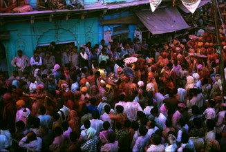 A Holi processions winds through a town in Uttar Pradesh.