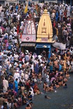 Hindu pilgrims bathing in the sacred Ganges at Hardwar
