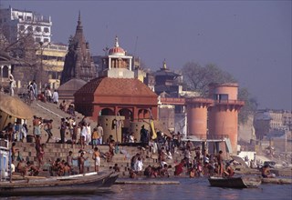 View of the ghats and people bathing at Varanasi