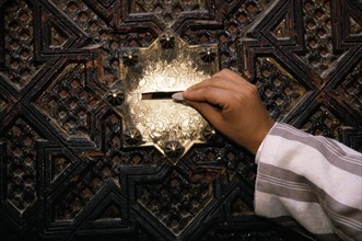 Giving Zakat, Alms, Kairouine Mosque in Fez, Morocco