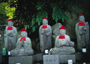 Jizou spirit guardians in a temple garden in Japan