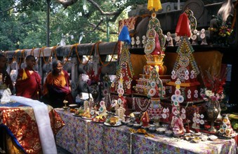 Elaborate offerings under the Bodhi Tree, site of Buddhas enlightenment at Bodhgaya, India