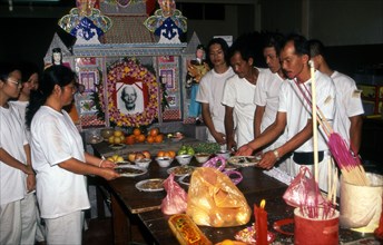 Mourning, Chinese family in a funeral house in Malacca, Malaysia