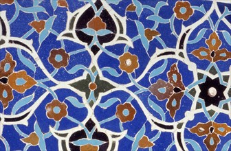 Glazed tiles adorning the brickwork of a a Persian mosque in Isfahan