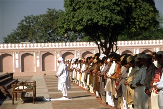Islamic funeral ceremony at Salat-ul-Junazah, with Imam in front
