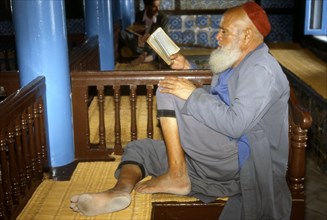 Practising person in a synagogue on Djerba island, Tunisia