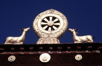 Tibet, the Wheel of Law (with Sankrit on spokes), flanked by gazelles, Jokhang monastery, Lhasa, Tibet