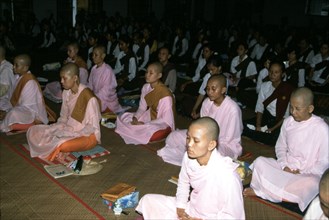 Nuns meditating in a monastery, Burma