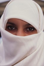 Muslim woman wearing the traditional hijab scarf in London, Great Britain