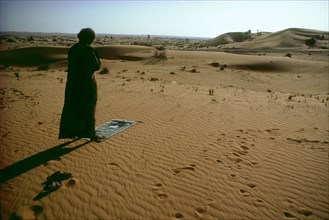 Bedouin praying in direction of Mecca