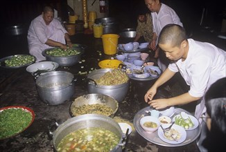 Buddhist nuns prepare lunch in a monastery in Thailand