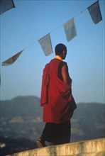 Buddhist monk walking and meditating early morning in Nepal
