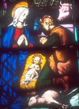 Mary and Joesph and baby Jesus stained glass window
scene of the Nativity, Bethlehem