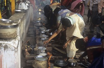Hindu women cooking pongal associated with Sun-God worship