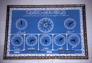 Prayers time on a board outside a mosque in Morocco