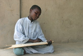 Boy in Chad with Quran slate
