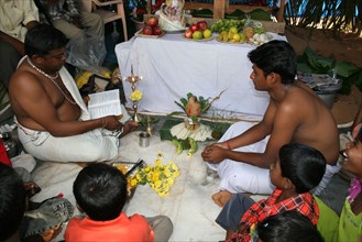 Brahmin priest presiding at the sacred thread ceremony